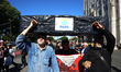 People with disabilities, their families, and healthcare providers demonstrate in front of...