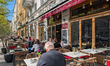 People engage in daily activities along streets and squares in Haidhausen, Munich, Bavaria...