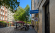 People engage in daily activities along streets and squares in Haidhausen, Munich, Bavaria...