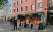 People engage in daily activities along streets and squares in Haidhausen, Munich, Bavaria...