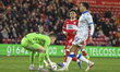 Murphy Cooper, Sheffield Wednesday goalkeeper, gathers the ball ahead of Jeremy Sarmiento...