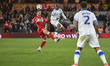Sean Fusire of Sheffield Wednesday moves the ball forward ahead of Alan Browne of Middlesb...