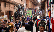 People walk a market street in the Medina district in Marrakesh, Morocco on April 21, 2026...