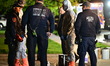 Members of the Nassau County Hazmat Team work at the scene of a residence on Patricia Lane...