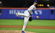 New York Mets starting pitcher Clay Holmes #35 throws during the fifth inning of a basebal...