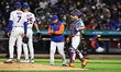 New York Mets manager Carlos Mendoza takes pitcher Brooks Raley out of the game during the...