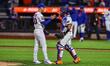 The New York Mets relief pitcher Luke Weaver #30 and Francisco Alvarez #4 celebrate after...