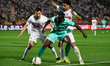 Pyramids FC player Fiston Mayele, in green, dribbles the ball during the Zamalek vs Pyrami...