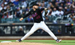 New York Mets starting pitcher Christian Scott #45 throws during the first inning of a bas...
