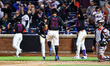 New York Mets player Tommy Pham #39 scores during the eighth inning of a baseball game aga...