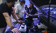 Visitors inspect a vehicle engine at the 19th Dhaka Auto Series of Exhibitions in Dhaka, B...