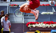 Casper Ruud of Norway jumps during his pre-match routine before facing Jaume Munar of Spai...