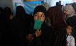 Palestinian voters arrive to cast their ballots at a polling station during municipal elec...