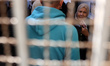Palestinian voters arrive to cast their ballots at a polling station during municipal elec...