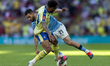Rayan Ait-Nouri of Manchester City is tackled by Welington of Southampton during the Emira...