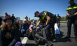 Police carry out numerous arrests following a protest that blocks a major roadway near De...