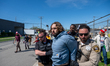A protester is detained after crossing a barrier of a "free speech zone" established by la...