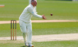 Matt Parkinson of Kent County Cricket Club receives the ball as he continues his over bowl...