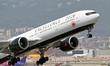 An Air Canada Boeing 777-333(ER) featuring a special livery dedicated to the 50 winners of...