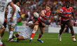 Charlie Atkinson of Gloucester Rugby offloads the ball mid-tackle during the Gallagher Pre...