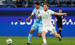 Douglas Santos (L) of Zenit and Maksim Samorodov of Akhmat vie for the ball during the Rus...