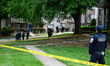 Members of the U.S. Marshals and Metropolitan Police Department work at the scene where a...