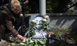 People lay candles and flowers during an animal rights march 'Break the chains' in memory...