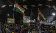 Supporters and fans of the Trinamool Congress (TMC) attend an election campaign meeting in...