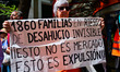 Demonstrators gather outside the People's Party (PP) headquarters on Calle Genova in Madri...