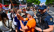 Demonstrators gather outside the People's Party (PP) headquarters on Calle Genova in Madri...