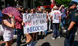 Demonstrators gather outside the People's Party (PP) headquarters on Calle Genova in Madri...
