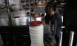 Workers spin yarn inside a textile facility in Kebayoran, South Jakarta, Indonesia, on Apr...