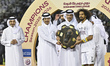 Al Sadd SC captain Akram Afif (right) receives the shield after winning the Doha Bank Qata...