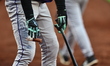 Colorado Rockies player Troy Johnston #20 prepares his bat while on deck during the fifth...