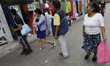 Members of various collectives place missing person posters on letters in the streets of t...