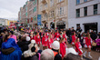 Participants of the KV Uetzhaus club ride a decorated float during the Rosenmontagszug par...