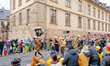 Musicians from the LKT Lustige Kumpels Thalau association march past the Stadtschloss pala...