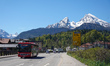 Road traffic moves below the Watzmann massif in Berchtesgaden, Upper Bavaria, Bavaria, Ger...