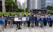 Families of victims from the Jeju Air crash at Muan Airport hold a press conference in fro...