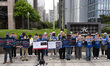 Families of victims from the Jeju Air crash at Muan Airport hold a press conference in fro...