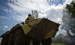 Military APC passes the check point near Slaviansk.  Ukrainian army continues to keep the...