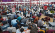 Election officials check electronic voting machines and other polling materials on the eve...