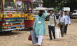 Election officials leave for polling stations after collecting electronic voting machines...