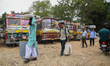Election officials leave for polling stations after collecting electronic voting machines...