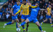 Tyler Roberts of Mansfield Town is challenged by Tom Lees of Peterborough United during th...