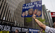 Members and supporters of Rise and Resist and Truth Tuesdays gather for a weekly protest o...