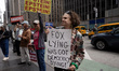 Members and supporters of Rise and Resist and Truth Tuesdays gather for a weekly protest o...
