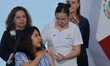 A woman receives a vaccine during a briefing to promote the national vaccination campaign...