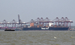 A container ship operated by Hapag-Lloyd is docked at a busy port in Mumbai, India, on Apr...