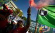 Workers and union organizations march during a demonstration called by the CGT on Internat...